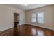 Hardwood floors and large window in this bedroom at 523 North Ave, Hapeville, GA 30354