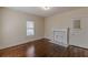 Hardwood floors and fireplace in this bright bedroom at 523 North Ave, Hapeville, GA 30354