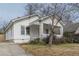 White house with a covered porch and landscaping at 523 North Ave, Hapeville, GA 30354