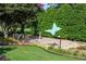 Landscaped garden with a unique butterfly sculpture at 523 North Ave, Hapeville, GA 30354