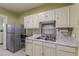 Kitchen with stainless steel refrigerator and microwave at 523 North Ave, Hapeville, GA 30354