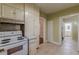 Kitchen with white cabinets and access to other rooms at 523 North Ave, Hapeville, GA 30354