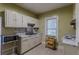 Efficient kitchen with white cabinets and appliances at 523 North Ave, Hapeville, GA 30354