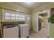 Laundry room with washer, dryer, and kitchen access at 523 North Ave, Hapeville, GA 30354