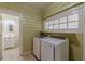 Laundry room with washer, dryer, and extra storage at 523 North Ave, Hapeville, GA 30354