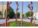 Colorful metal figures climbing a pole in a roundabout at 523 North Ave, Hapeville, GA 30354