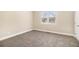 Bedroom featuring neutral carpet and two windows at 118 Strickland St, Fairburn, GA 30213
