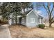 Home featuring gray siding, white trim, and a well-maintained lawn at 118 Strickland St, Fairburn, GA 30213