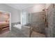 Gorgeous bathroom featuring a soaking tub and separate walk-in shower with gray tile at 1461 Thomas St, Conyers, GA 30094