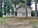 Brick house with a large front yard and mature trees at 4048 Rainbow Dr, Decatur, GA 30034