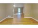 Hardwood floor hallway with view into living room at 4048 Rainbow Dr, Decatur, GA 30034