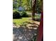 Landscaped backyard with mature trees and lawn at 4654 Hope Springs Rd, Stone Mountain, GA 30083