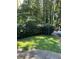 Partially visible front yard with a well-maintained hedge at 4654 Hope Springs Rd, Stone Mountain, GA 30083