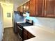 Kitchen with wood cabinets, stainless steel appliances, and neutral countertops at 798 Windchase Ln, Stone Mountain, GA 30083