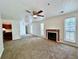 Spacious living room with fireplace, carpet, and neutral walls, creating a welcoming atmosphere at 798 Windchase Ln, Stone Mountain, GA 30083