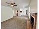 Spacious living room with fireplace, carpet, and neutral walls, creating a welcoming atmosphere at 798 Windchase Ln, Stone Mountain, GA 30083