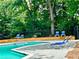 Relaxing pool area with wooden deck and lounge chairs at 798 Windchase Ln, Stone Mountain, GA 30083