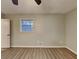 This bedroom is a blank canvas with wood-look floors and neutral paint at 1581 Wesley Nw Way, Conyers, GA 30012