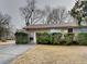 Charming brick home with a well-manicured front yard and covered entry at 1581 Wesley Nw Way, Conyers, GA 30012
