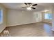 Spacious living room with hardwood floors and ceiling fan at 1581 Wesley Nw Way, Conyers, GA 30012