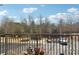 Outdoor balcony area overlooking parking area with a tree lined perimeter at 2732 Wander Ln, Alpharetta, GA 30022