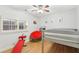 bedroom with a unique red papasan chair and bunkbeds with grey frames at 2732 Wander Ln, Alpharetta, GA 30022