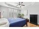 Spacious bedroom featuring tray ceilings, hardwood floors, and large windows at 2732 Wander Ln, Alpharetta, GA 30022