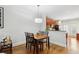 Cozy dining area with a view of the open kitchen and hardwood flooring at 2732 Wander Ln, Alpharetta, GA 30022