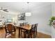 Open dining area with hardwood floors connecting to the living room and kitchen at 2732 Wander Ln, Alpharetta, GA 30022