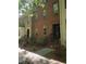 Charming brick townhome with a classic design and inviting entrance staircase at 2732 Wander Ln, Alpharetta, GA 30022