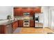 Updated kitchen with stainless steel appliances, granite countertops, and hardwood floors at 2732 Wander Ln, Alpharetta, GA 30022