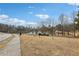 Scenic view of the lake with geese on the grassy shore at 2732 Wander Ln, Alpharetta, GA 30022