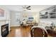 Cozy living area with a fireplace, hardwood floors, and plenty of natural light at 2732 Wander Ln, Alpharetta, GA 30022