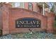 Entrance sign for Enclave at Milton Park with brick surround at 2732 Wander Ln, Alpharetta, GA 30022