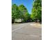 Neighborhood street view lined with mature trees creating a shady canopy at 2732 Wander Ln, Alpharetta, GA 30022