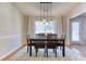 Bright dining room with chandelier and hardwood floors at 4078 Savannah Ridge Ct, Loganville, GA 30052