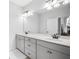 Elegant bathroom featuring double sinks, sleek cabinetry, and a large mirror at 532 Green St, Lawrenceville, GA 30046