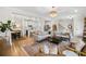 Bright living room showcasing an open layout, hardwood floors, and seamless flow into the kitchen at 532 Green St, Lawrenceville, GA 30046