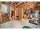 Unfinished basement showing exposed beams, stairs, and concrete floor ready for customization at 1545 Camden Cove Dr, Cumming, GA 30040