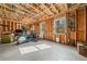 Unfinished basement area with wood ceiling, exposed walls, work-out equipment at 1545 Camden Cove Dr, Cumming, GA 30040