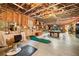 Unfinished basement featuring an open ceiling, a pool table and a putting green at 1545 Camden Cove Dr, Cumming, GA 30040