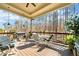 Inviting covered deck with outdoor seating, grill, and a serene view of the wooded backyard at 1545 Camden Cove Dr, Cumming, GA 30040