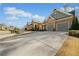 Charming home showcasing a brick and shingle exterior and well-maintained landscaping at 1545 Camden Cove Dr, Cumming, GA 30040