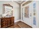 Elegant foyer featuring a decorative glass door and a stylish wooden console table at 1545 Camden Cove Dr, Cumming, GA 30040