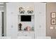 Open kitchen area featuring custom cabinets, a cozy breakfast bar, and a TV at 1545 Camden Cove Dr, Cumming, GA 30040