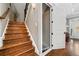 Staircase showcasing wood stairs, an elevator door and views to the front of the home at 1545 Camden Cove Dr, Cumming, GA 30040