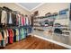 Organized walk-in closet featuring ample shelving and rods for clothing and shoe storage at 1545 Camden Cove Dr, Cumming, GA 30040