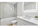 Elegant bathroom with a sleek shower-tub combination, modern fixtures, and marble-like tile at 2575 Peachtree Ne Rd # 6G, Atlanta, GA 30305