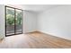Bright and open bedroom with hardwood floors and large sliding doors to a balcony at 2575 Peachtree Ne Rd # 6G, Atlanta, GA 30305