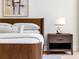 Beautifully staged bedroom featuring a wooden bed frame and minimalist decor at 2575 Peachtree Ne Rd # 6G, Atlanta, GA 30305